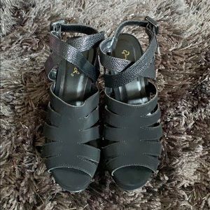 Sued black high heel wedges